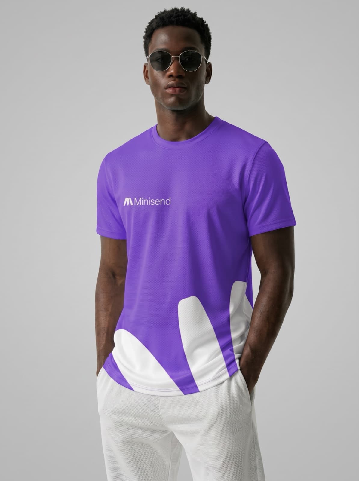 Man in sunglasses wearing the purple Mark tee with a white mark across the hem