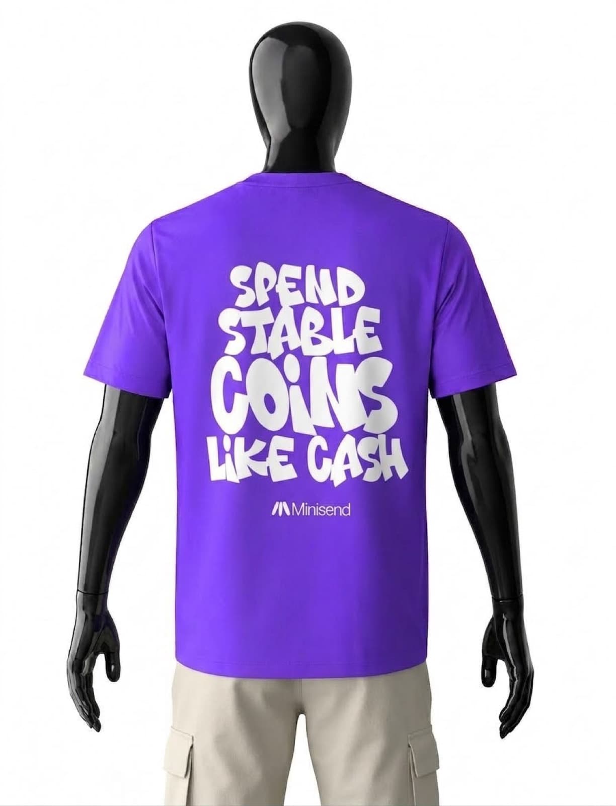 Back of the purple tee on a mannequin, printed "Spend stablecoins like cash"